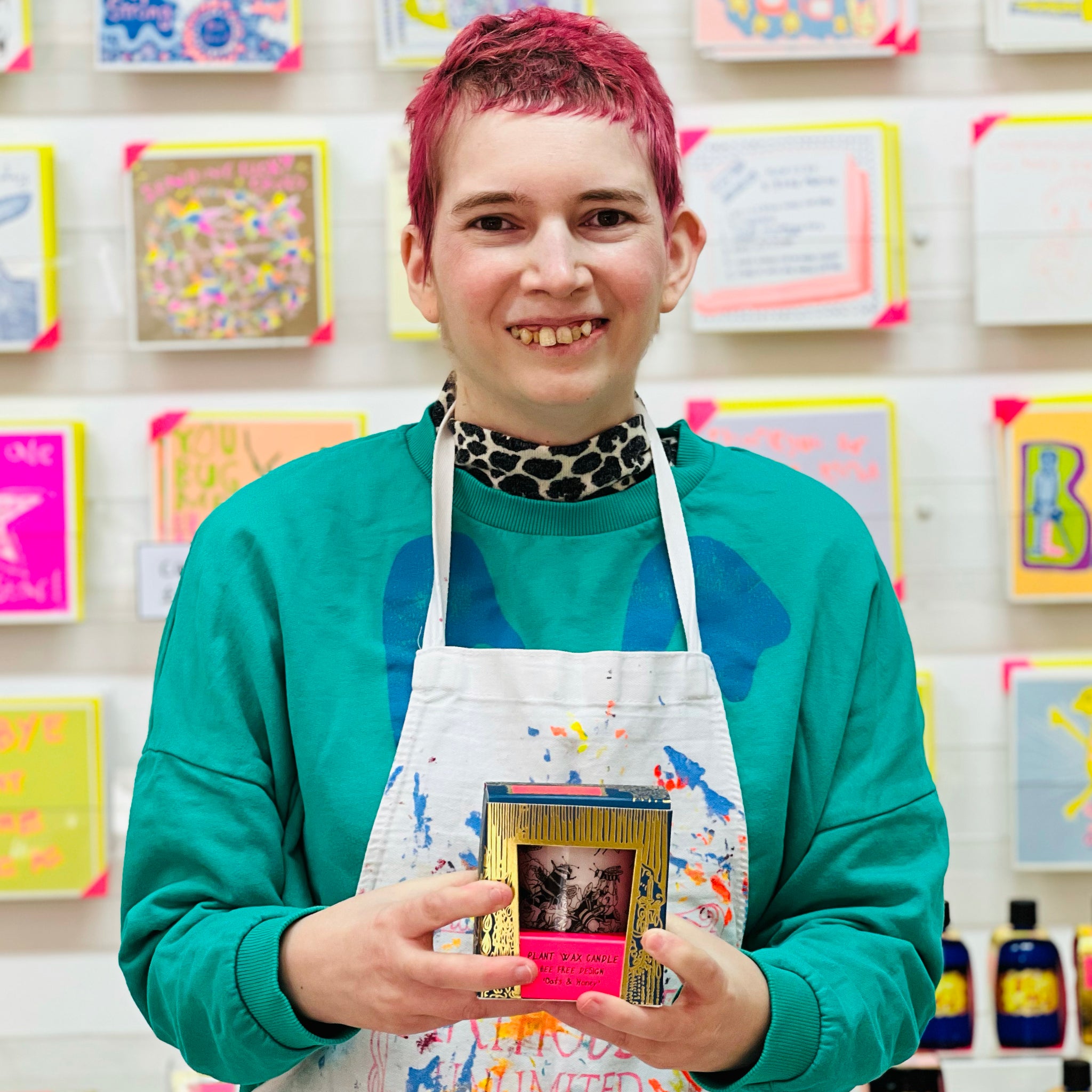 Female artist holding Bee Free, Oats & Honey Scented Plant Wax Candle