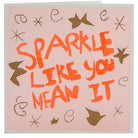 A peach, orange and gold card with the hand drawn words 'sparkle like you mean it' 