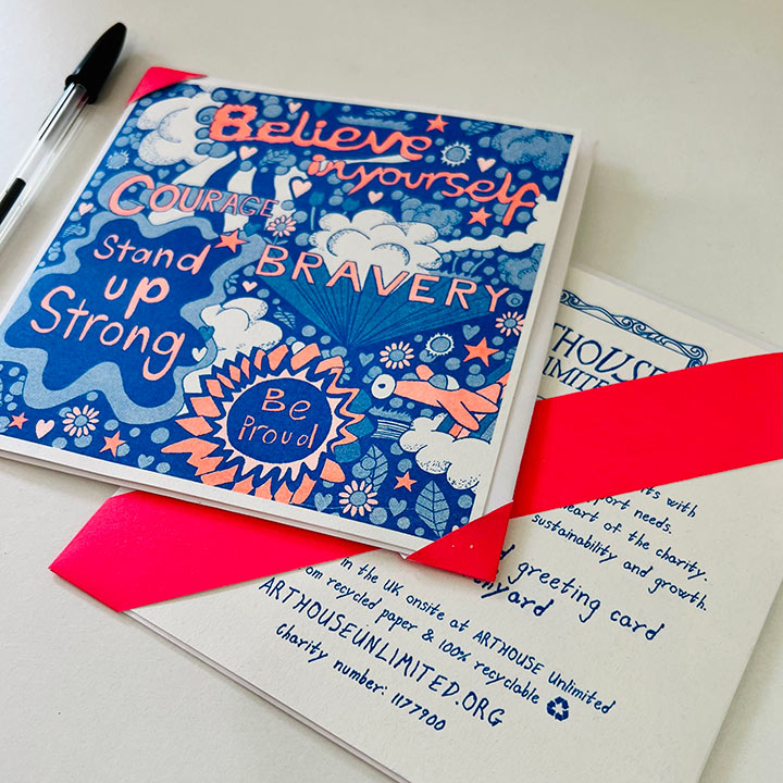 A blue and orange card with uplifting messages hand drawn onto it such as Believe in your self and bravery 