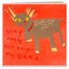 An orange, gold and yellow card with a hand drawn deer and the words stay merry and bright my deer