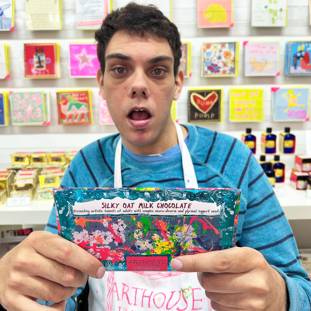 Male artist holding Spring silky oat milk chocolate bar