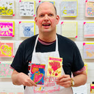 Artist holding packet of beetroot seeds