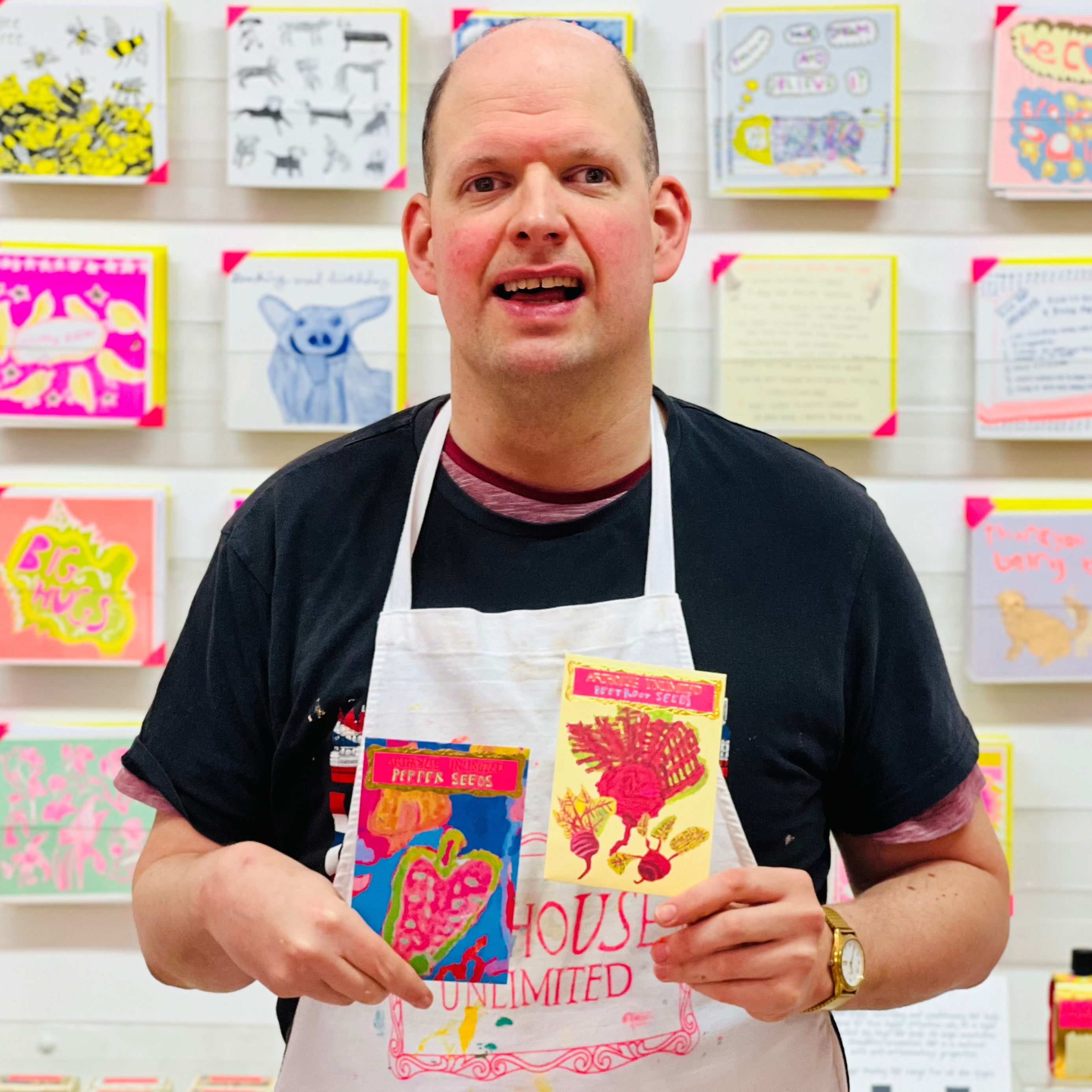 Artist holding packet of beetroot seeds