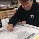 Female artist drawing a woman in pencil 