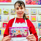 Female artist holding Yellow Daffodil White Chocolate Bar with Pick 'n' Mix Sweets