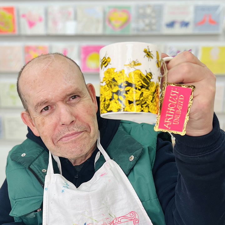 Male artist holding Yellow and black Bee Free, Fine Bone China Mug