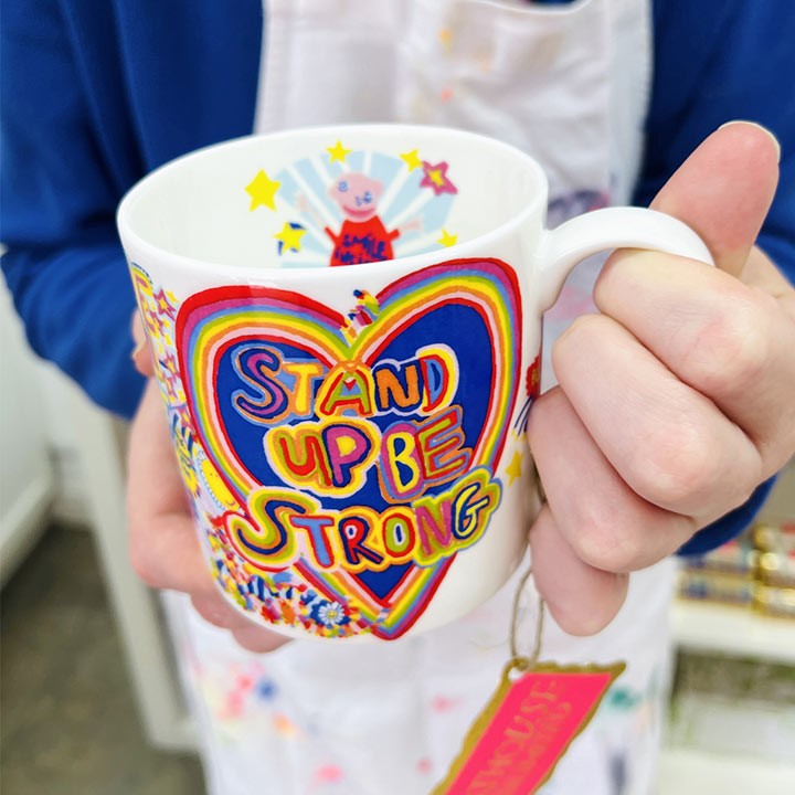 hands holding bright coloured Full of Joy, Fine Bone China Mug