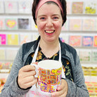 Female artist holding Full of Joy, Fine Bone China Mug