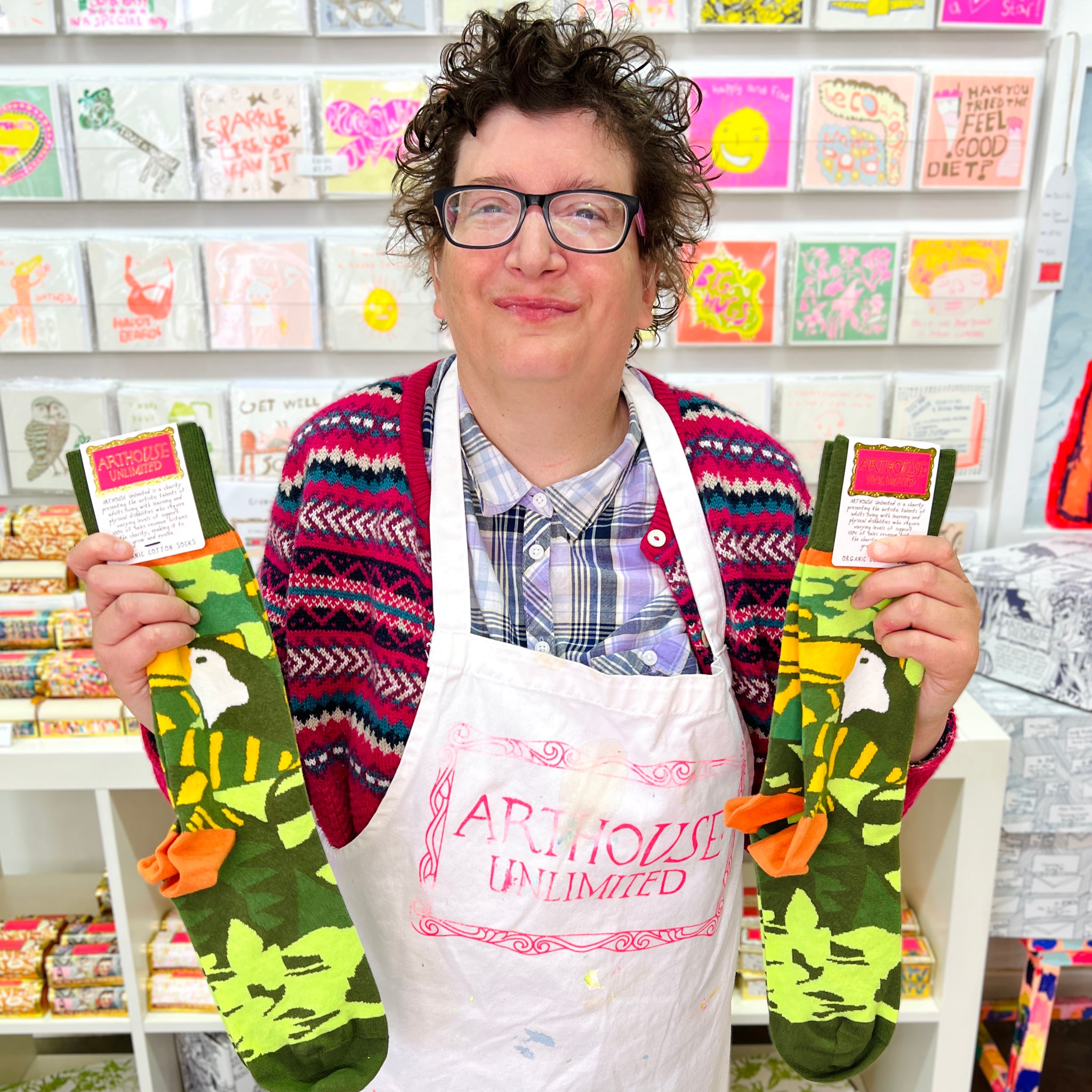 Female artist holding a pair of Amazon, Organic Cotton Socks