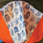 Blue Dogs, 100% Organic Tea Towel over the back of a chair
