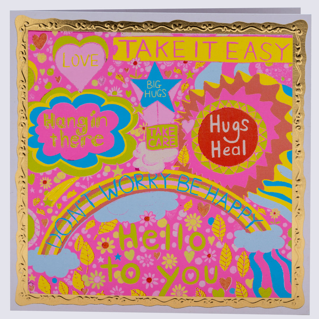 A colorful greetings card with a gold embossed frame, featuring various designs such as stars, hearts, and floral patterns, with the text 'Take it Easy' and 'Hugs HEAL'.