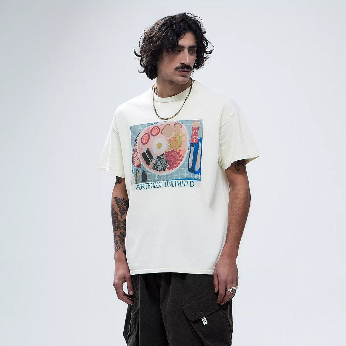 Male model wearing a arthouse unlimited white t-shirt with a hand painted picture of a fry up breakfast 