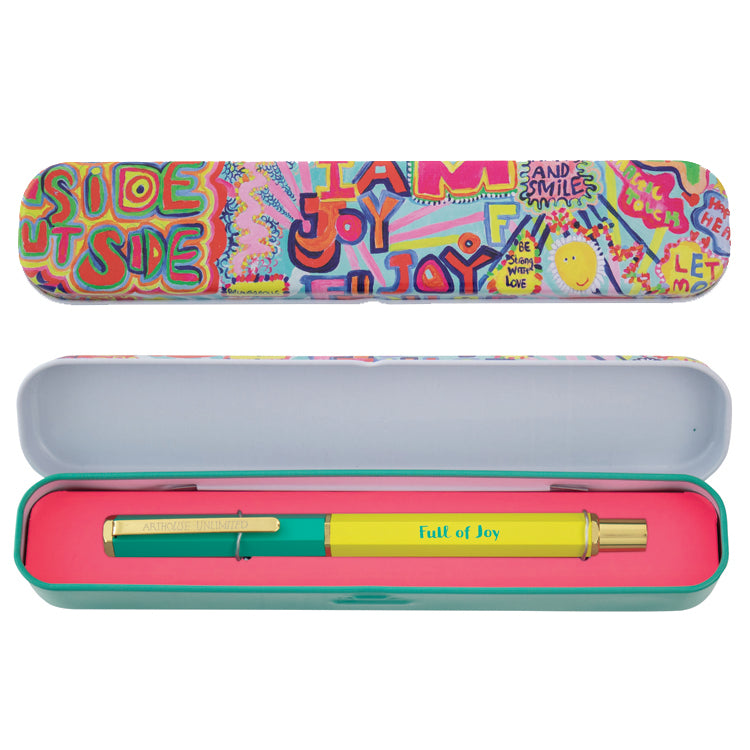A colorful pen and its packaging with abstract art designs. The pen is yellow and green, and the tin is decorated with various artistic illustrations in a multicolored pattern.