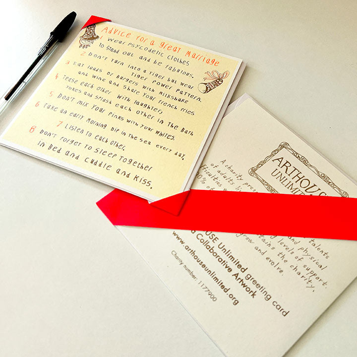 A yellow and orange card with a hand drawn list of  advice for a great marriage 