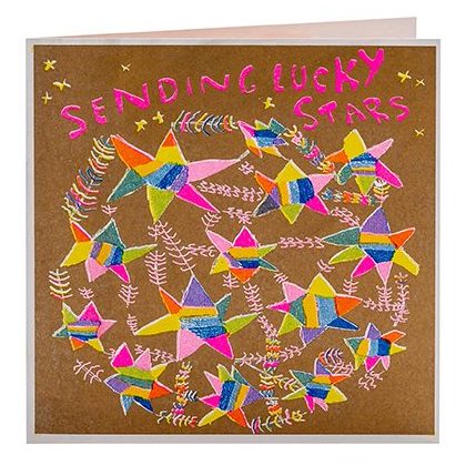 A gold and bright coloured card with hand drawn stars and the words sending lucky stars 
