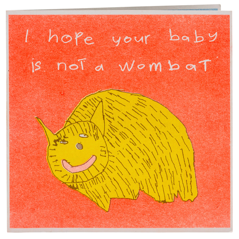 An orange and yellow card with a drawing of a wombat and the words I hope your baby isn't a wombat 