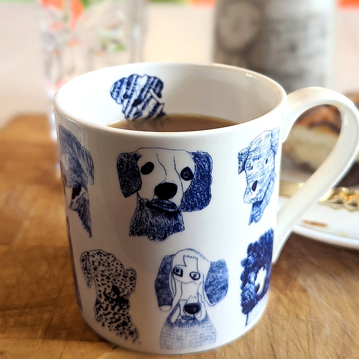 a cup of tea in Blue Dogs, Fine Bone China Mug with dog drawings 