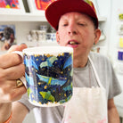 Male artist holding Bat Mates, Fine Bone China Mug