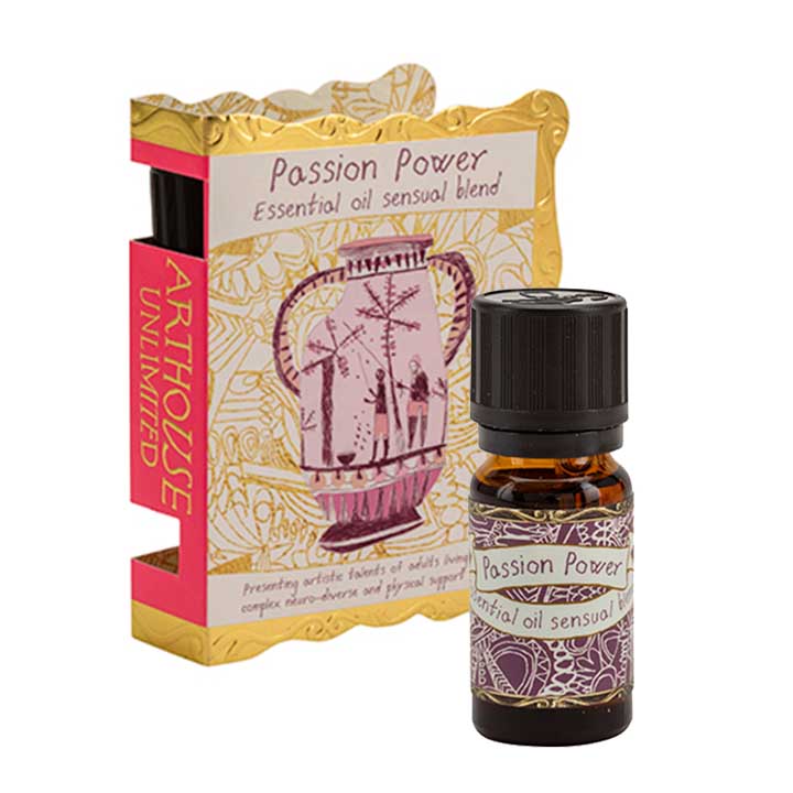 Gold and pink paket and bottle of Passion Power, Well Being Essential Oil, Sensual Blend