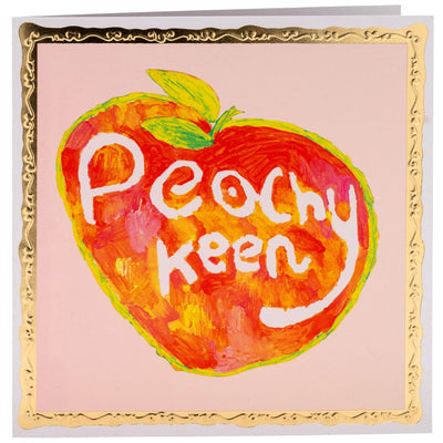 Bright painting on a peach with the text 'Peachy keen' written in white.