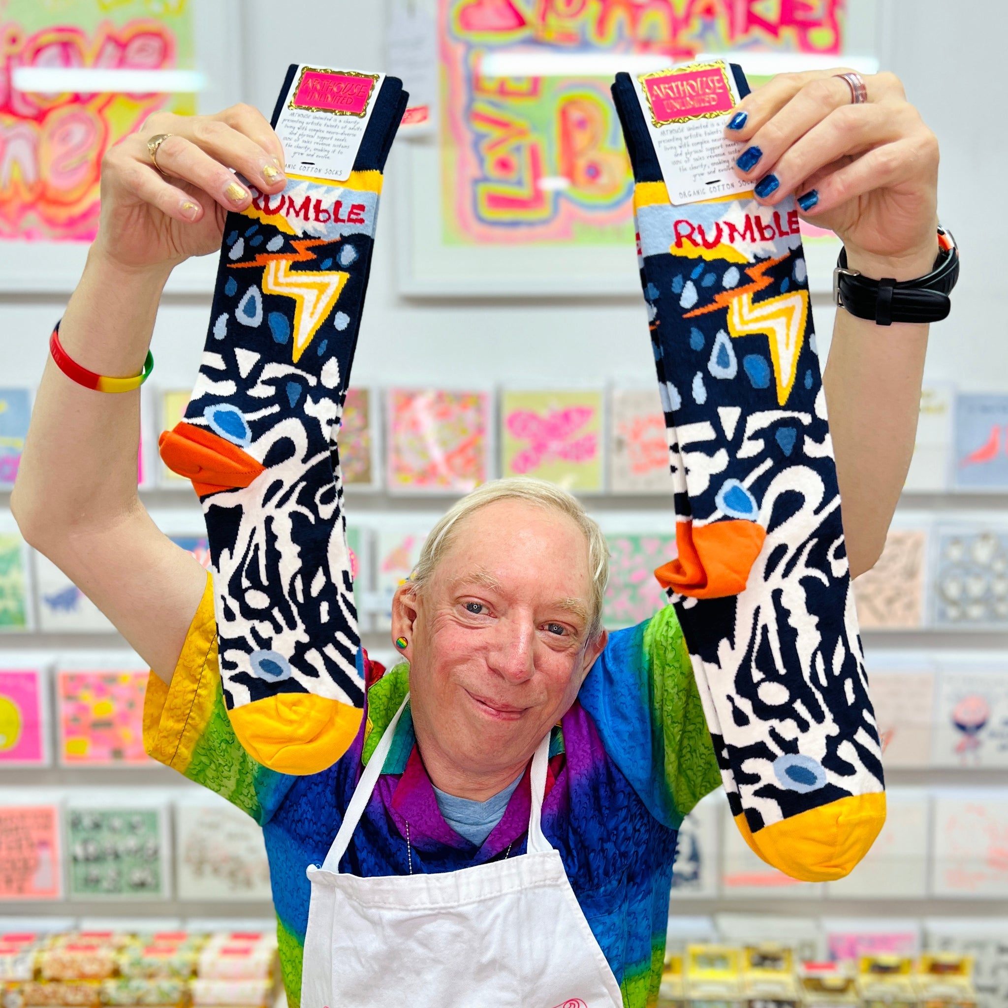 Male artist holding Rumble, Organic Cotton Socks